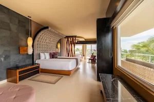 https://www.palmarbeachresortandspa.com/galleries/Suites/MASTER BEDROOM KING CORNER SUITE OCEAN FRONT.webp